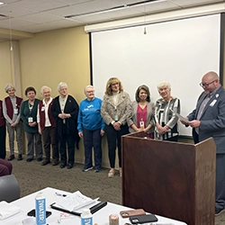Damon Harbison speaking at fundraising event