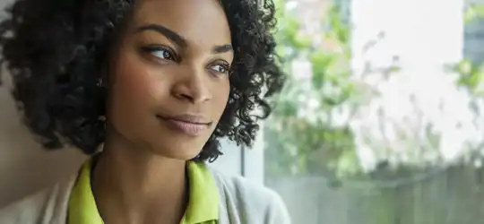 Woman gazing out window