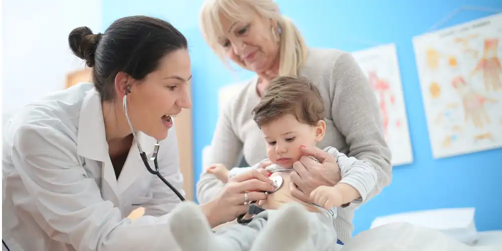 doctor listening to baby's heart