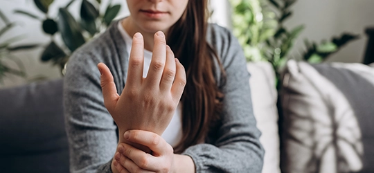 woman holding her wrist