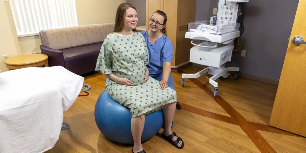 woman-in-labor-on-exercise-ball