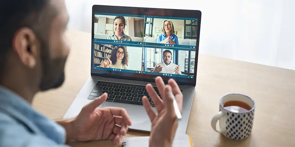 man meeting with council members via Zoom