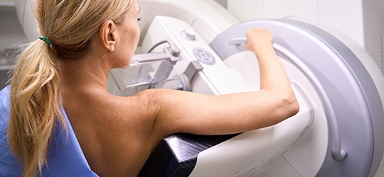 woman getting mammogram