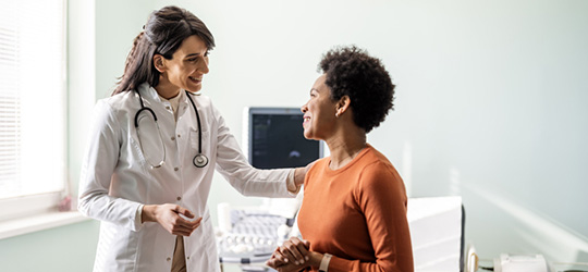 woman speaking to doctor