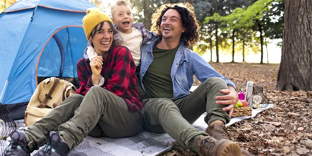 family camping in the autumn woods