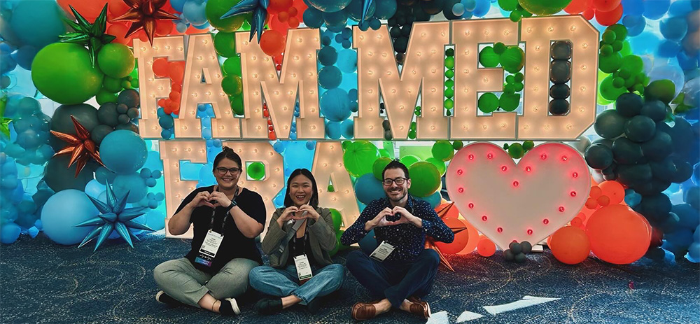 residents sitting in front of Fam Med balloon decorations 