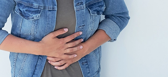 Person bracing stomach.