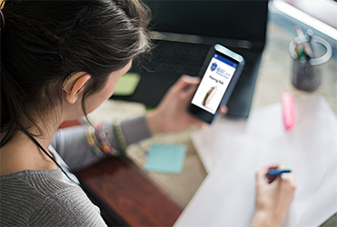 woman with hearing aid looking at SLUCare's hearing aid selections